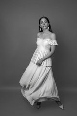 Aqua off shoulder peplum top with high-low skirt.