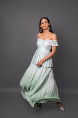 Aqua off shoulder peplum top with high-low skirt.