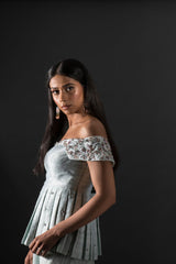 Aqua off shoulder peplum top with high-low skirt.